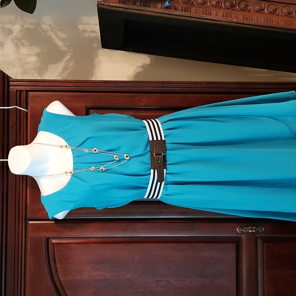 Sleeveless teal dress with belt
